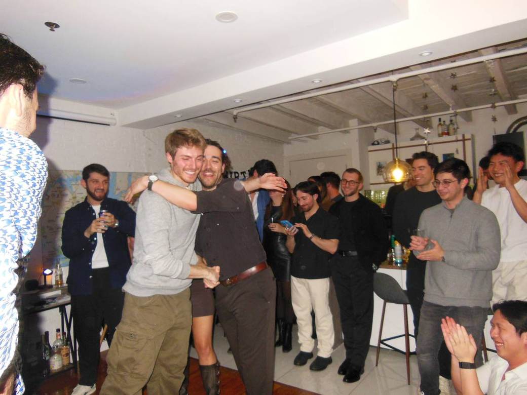 An audience watching a magic performance at a venue